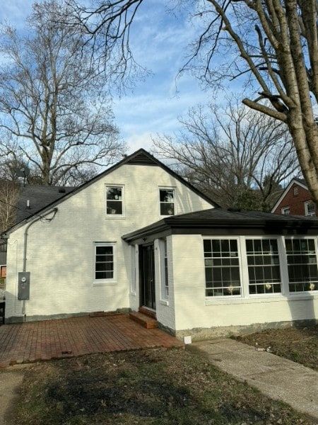 Residential exterior with updated paint along siding and trim.