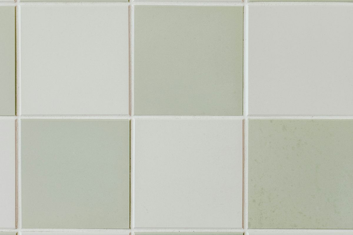 Gray and white tile surface with crisp grout lines.