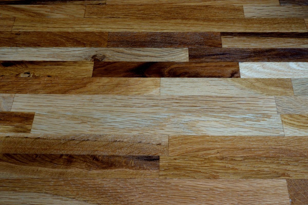Wood-look plank flooring with mixed warm tones.